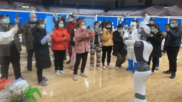 A robot is dancing in a hospital in Wuhan