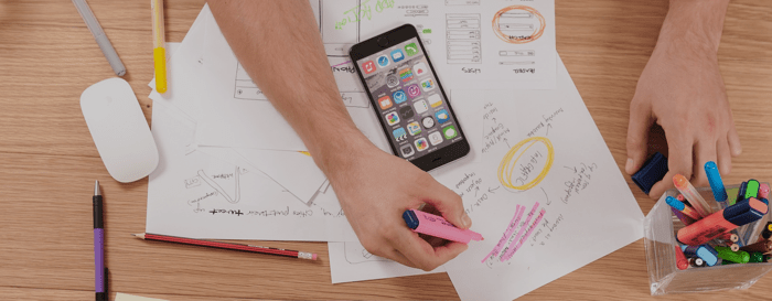 person creating prototypes at his desk